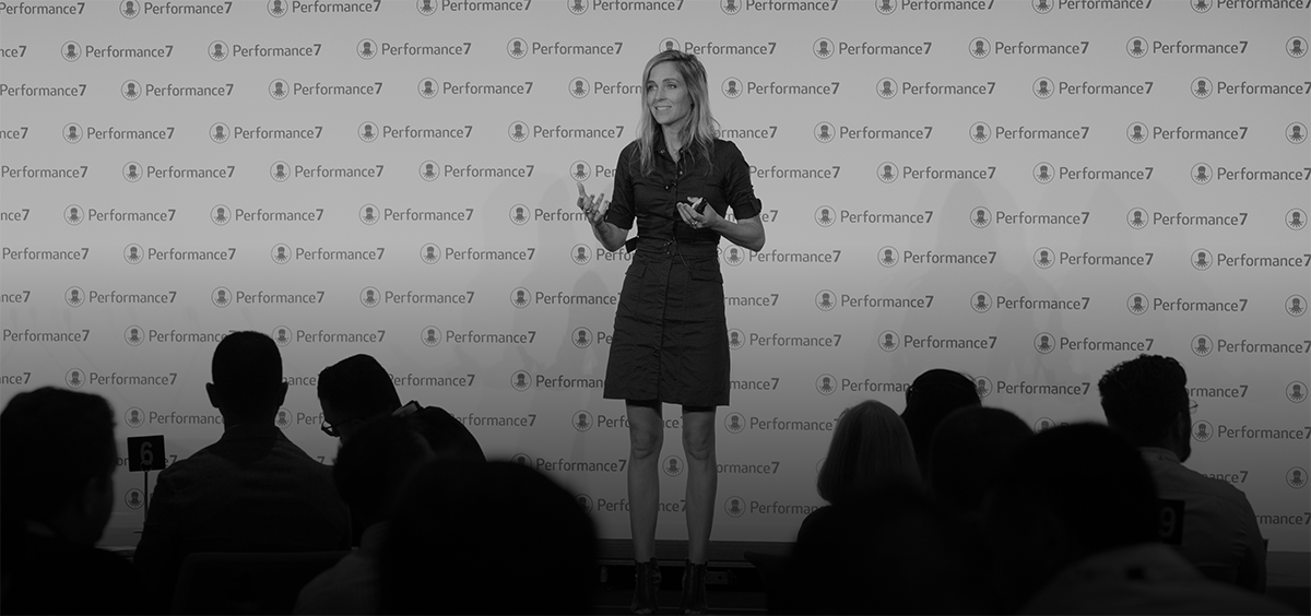 Franziska speaking on stage